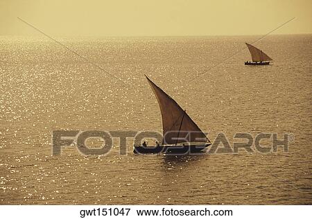 Two sail boats in the sea View Large Photo Image Stock Photo - Two sail boats in the sea. Fotosearch