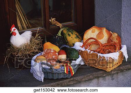 Close-up of bread in a wicker basket with a hen in a nest, Hall, Austria View Large Photo Image Stock Image - Close-up of bread in a wicker basket with a hen in a nest, Hall, Austria. Fotosearch