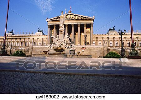 Stock Image - Fountain in front of a government building, Pallas Athena Fountain, Parliament Building, Vienna, Austria. Fotosearch