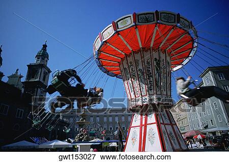 Stock Photo - Low angle view of a chain swing ride at a carnival, Salzburg, Austria. Fotosearch