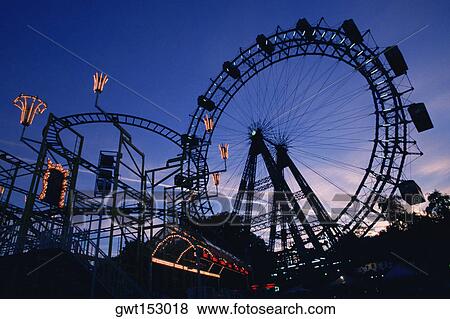 Stock Photo - Silhouette of amusement park rides, Prater Park, Vienna, Austria. Fotosearch