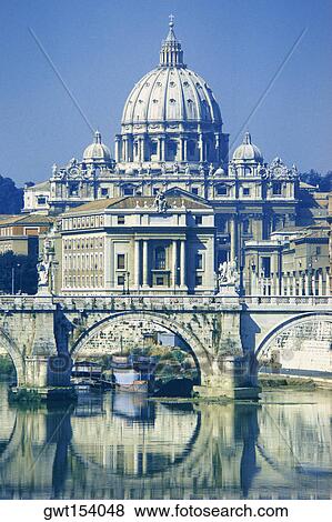 Stock Photo - Arch bridge across a river in front of a basilica, St. Peter's Basilica, Vatican City. Fotosearch