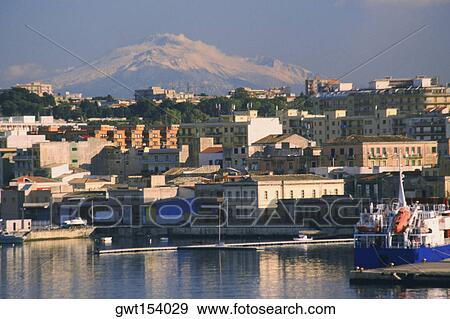 Buildings at the waterfront, Mt Etna, Siracusa, Sicily, Italy View Large Photo Image Stock Photo - Buildings at the waterfront, Mt Etna, Siracusa, Sicily, Italy. Fotosearch