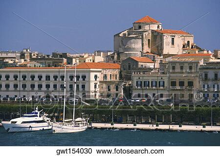 Stock Image - Buildings at the waterfront, Siracusa, Sicily, Italy. Fotosearch