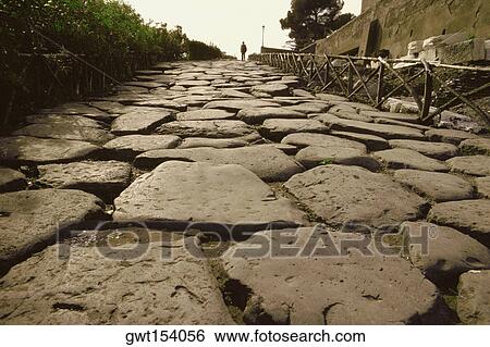 Stock Photograph - Close-up of cobblestone path, Appian Way, Rome, Italy. Fotosearch