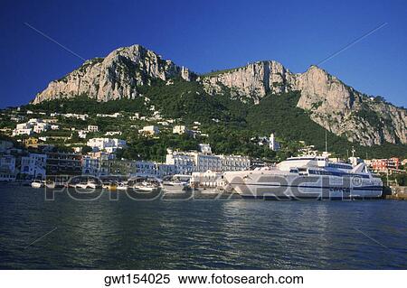 Cruise ship on a harbor in front of buildings, Capri, Italy View Large Photo Image Stock Photography - Cruise ship on a harbor in front of buildings, Capri, Italy. Fotosearch