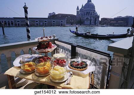 Dessert on a table near a canal, Grand Canal, Venice, Veneto, Italy View Large Photo Image Stock Image - Dessert on a table near a canal, Grand Canal, Venice, Veneto, Italy. Fotosearch