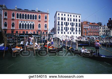 Gondolas moored in a canal in front of buildings, Grand Canal, Venice, Veneto, Italy View Large Photo Image Stock Photography - Gondolas moored in a canal in front of buildings, Grand Canal, Venice, Veneto, Italy. Fotosearch