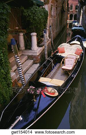 High angle view of a gondola moored in a canal, Venice, Italy View Large Photo Image Picture - High angle view of a gondola moored in a canal, Venice, Italy. Fotosearch