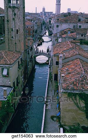 High angle view of buildings along a canal, Venice, Veneto, Italy View Large Photo Image Stock Image - High angle view of buildings along a canal, Venice, Veneto, Italy. Fotosearch