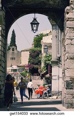 Stock Image - Lantern hanging from an archway, Taormina, Sicily, Italy. Fotosearch
