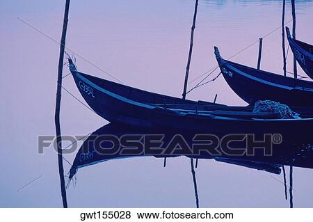 Fishing boats moored in a row, Valenca, Portugal View Large Photo Image Stock Photo - Fishing boats moored in a row, Valenca, Portugal. Fotosearch