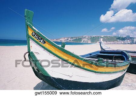 Fishing boats on the beach, Nazare, Portugal View Large Photo Image Stock Photo - Fishing boats on the beach, Nazare, Portugal. Fotosearch