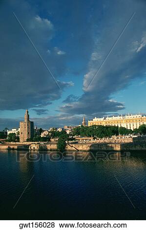 Buildings at the waterfront, Guadalquivir River, Seville, Spain View Large Photo Image Stock Photo - Buildings at the waterfront, Guadalquivir River, Seville, Spain. Fotosearch