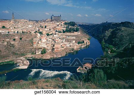 High angle view of a cityscape beside a river, Tagus River, Toledo, Spain View Large Photo Image Picture - High angle view of a cityscape beside a river, Tagus River, Toledo, Spain. Fotosearch