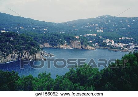 Stock Image - High angle view of cliffs along the sea, Costa Brava, Catalonia, Spain. Fotosearch