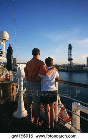 Rear view of a man and woman standing on cruise ship, Spain View Large Photo Image Stock Photography - Rear view of a man and woman standing on cruise ship, Spain. Fotosearch