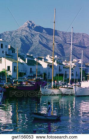 Stock Image - Yacht anchored in a harbor, Marbella, Andalusia, Spain. Fotosearch