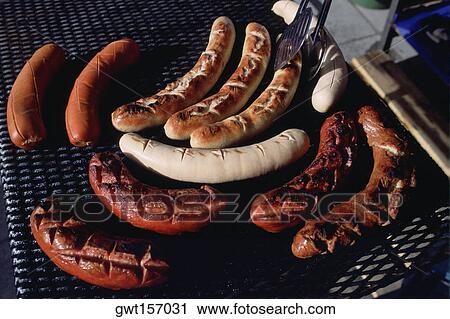 Close-up of sausages on a barbecue grill, Gruyeres, Switzerland View Large Photo Image Stock Image - Close-up of sausages on a barbecue grill, Gruyeres, Switzerland. Fotosearch