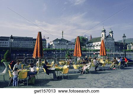 Group of people sitting at a sidewalk cafe, Lucerne, Switzerland View Large Photo Image Stock Image - Group of people sitting at a sidewalk cafe, Lucerne, Switzerland. Fotosearch