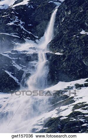 Snow falling from a mountain, Rosegg Valley, Switzerland View Large Photo Image Stock Photograph - Snow falling from a mountain, Rosegg Valley, Switzerland. Fotosearch