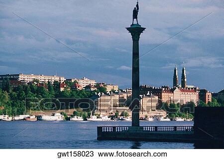 Low angle view of a statue on a pillar in a harbor, Stockholm, Sweden View Large Photo Image Stock Image - Low angle view of a statue on a pillar in a harbor, Stockholm, Sweden. Fotosearch
