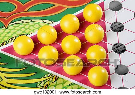 Stock Image - Close-up of a Chinese checkers board. Fotosearch