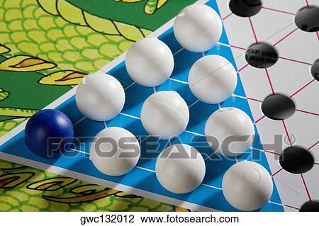 Stock Image - Close-up of a Chinese checkers board. Fotosearch