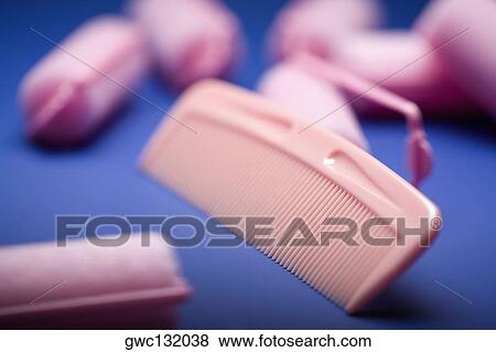 Close-up of a comb and hair curlers View Large Photo Image Stock Photo - Close-up of a comb and hair curlers. Fotosearch