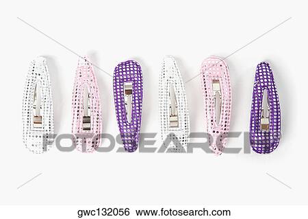 Close-up of a group of hair clips in a row View Large Photo Image Stock Photograph - Close-up of a group of hair clips in a row. Fotosearch