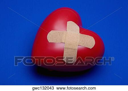 Close-up of a heart with a bandage on it View Large Photo Image Stock Image - Close-up of a heart with a bandage on it. Fotosearch