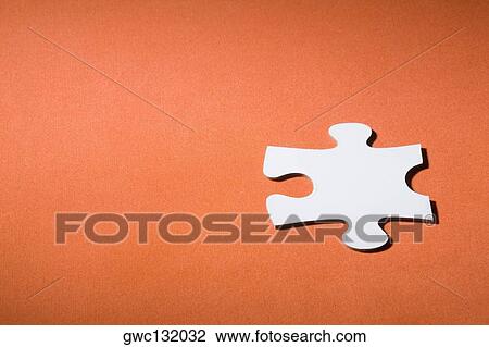 Stock Image - Close-up of a jigsaw piece. Fotosearch
