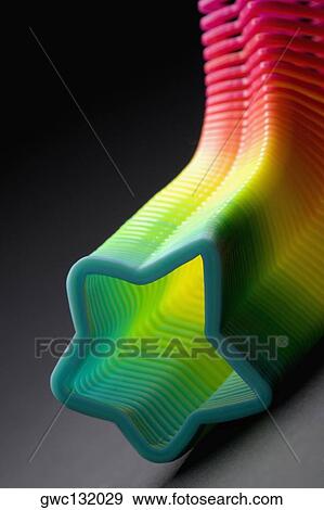Close-up of a multi-colored star shaped plastic spring View Large Photo Image Stock Photo - Close-up of a multi-colored star shaped plastic spring. Fotosearch