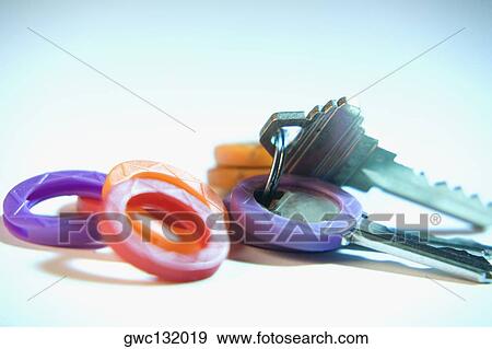 Close-up of keys in keyrings View Large Photo Image Stock Photo - Close-up of keys in keyrings. Fotosearch
