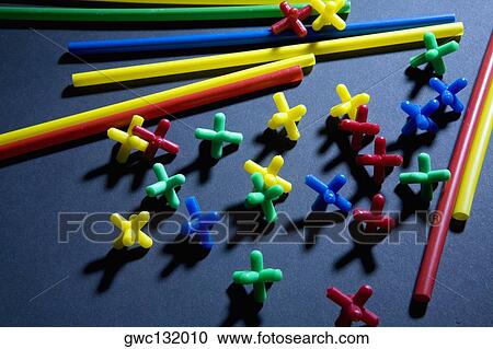 Close-up of multi-colored plastic objects View Large Photo Image Stock Image - Close-up of multi-colored plastic objects. Fotosearch