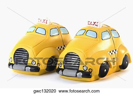Close-up of two toy taxis parked side by side View Large Photo Image Stock Image - Close-up of two toy taxis parked side by side. Fotosearch