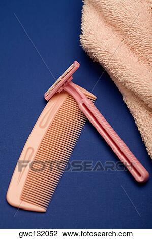 High angle view of a razor and a comb with a towel View Large Photo Image Stock Image - High angle view of a razor and a comb with a towel. Fotosearch