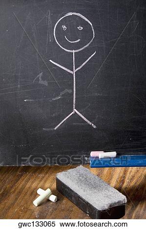 Stock Photography - Close-up of a drawing of a stick figure on a blackboard. Fotosearch