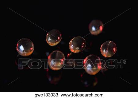 Close-up of a group of vitamin E capsules View Large Photo Image Stock Image - Close-up of a group of vitamin E capsules. Fotosearch