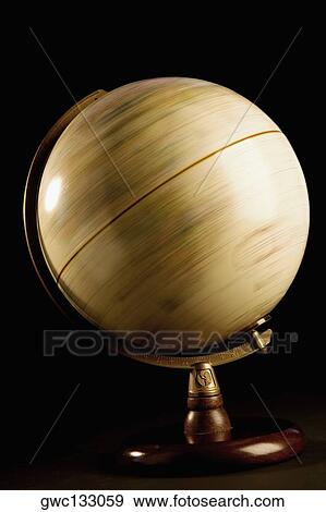 Close-up of a spinning globe View Large Photo Image Stock Photo - Close-up of a spinning globe. Fotosearch