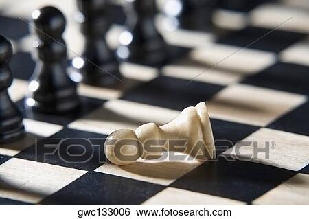 Close-up of chess piece on a chessboard View Large Photo Image Stock Photograph - Close-up of chess piece on a chessboard. Fotosearch