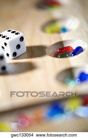 Close-up of dice on a game board View Large Photo Image Picture - Close-up of dice on a game board. Fotosearch