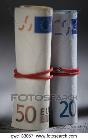 Close-up of paper currency rolls with rubber bands View Large Photo Image Stock Photo - Close-up of paper currency rolls with rubber bands. Fotosearch
