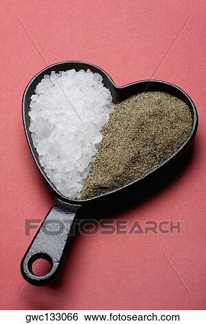 Close-up of sugar and celery seeds in a heart shaped pan View Large Photo Image Stock Photograph - Close-up of sugar and celery seeds in a heart shaped pan. Fotosearch