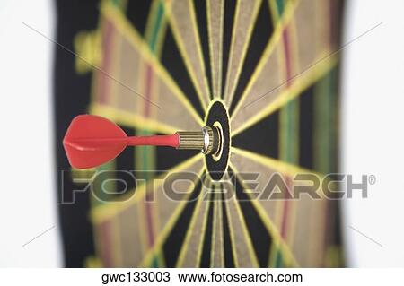 Dart in the bull's-eye of a dartboard View Large Photo Image Stock Image - Dart in the bull's-eye of a dartboard. Fotosearch