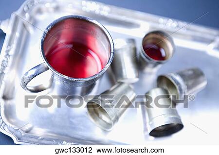 High angle view of a mug of red wine and glasses on a tray View Large Photo Image Stock Image - High angle view of a mug of red wine and glasses on a tray. Fotosearch
