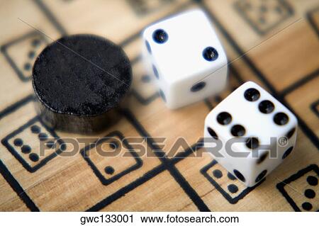 High angle view of a pair of dice on a game board View Large Photo Image Stock Image - High angle view of a pair of dice on a game board. Fotosearch