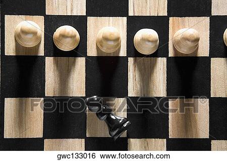 High angle view of chess pieces on a chessboard View Large Photo Image Stock Photograph - High angle view of chess pieces on a chessboard. Fotosearch