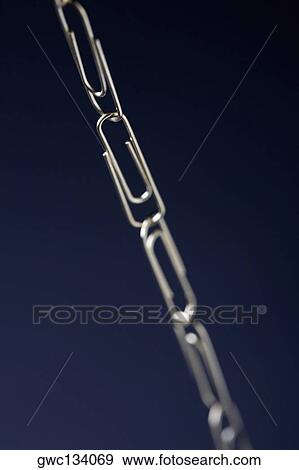 Close-up of a chain of interlocked paper clips View Large Photo Image Stock Photo - Close-up of a chain of interlocked paper clips. Fotosearch