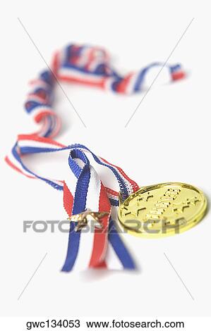 Close-up of a gold medal View Large Photo Image Stock Image - Close-up of a gold medal. Fotosearch